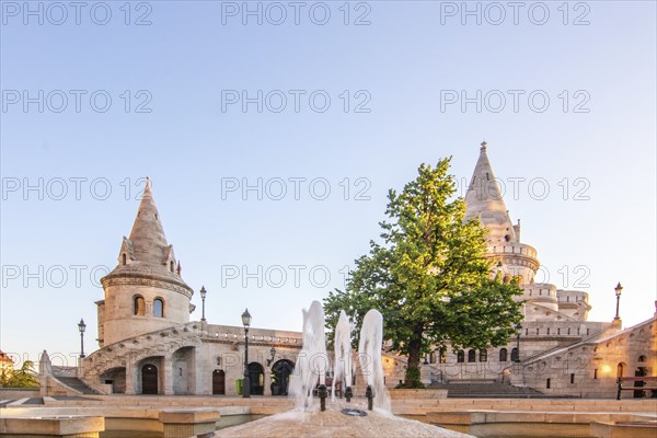 Old historic fortress and church at sunrise. City panorama at dusk. View of the Danube Fishermen's