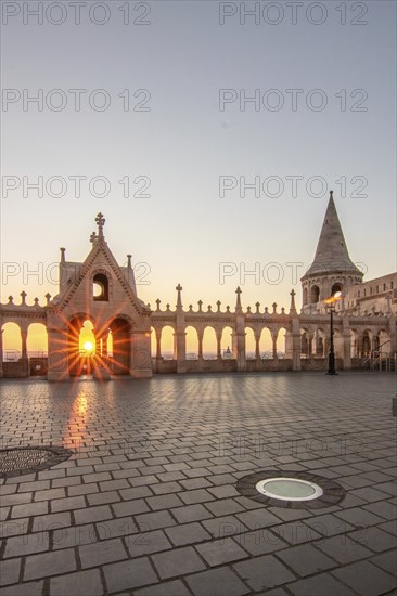 Old historic fortress and church at sunrise. City panorama at dusk. View of the Danube Fishermen's