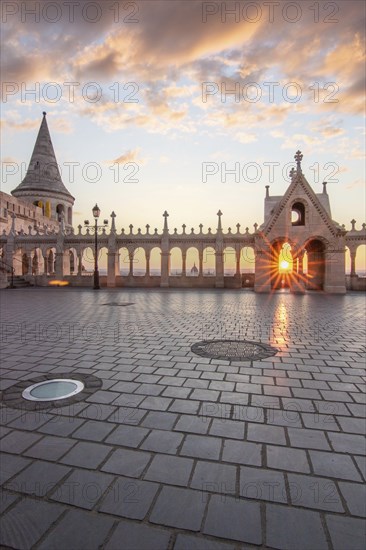 Old historic fortress and church at sunrise. City panorama at dusk. View of the Danube Fishermen's