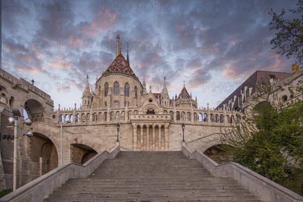 Old historic fortress and church at sunrise. City panorama at dusk. View of the Danube Fishermen's