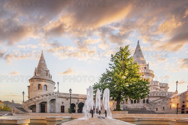 Old historic fortress and church at sunrise. City panorama at dusk. View of the Danube Fishermen's