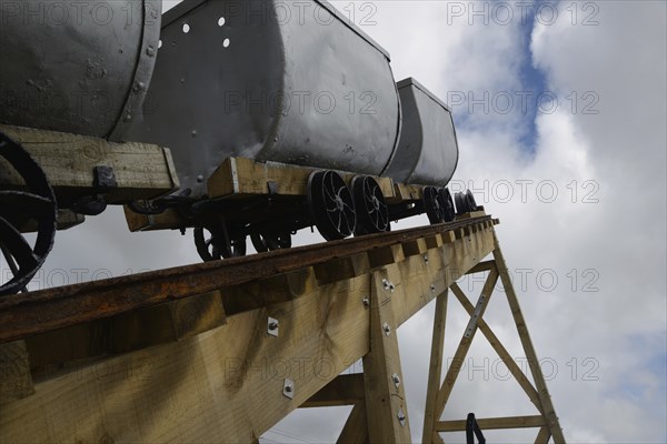 A coal mining memorial at Dobson in New Zealand features vintage coal wagons from an underground