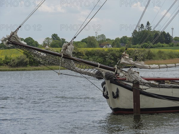 Close-up of the mast of a sailing boat against a calm natural backdrop, Kappeln,
