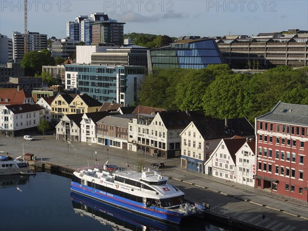 A cityscape with a harbour, modern buildings and boats under a clear sky, Stavanger, Norway, Europe