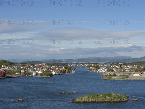 View of a city with houses and islands by the sea, surrounded by sky and clouds, Stavanger, Norway,