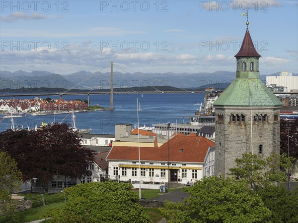 City view with church tower in the foreground, a bridge in the background and the sea, Stavanger,