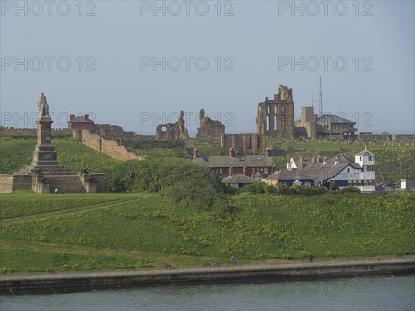 Landscape with historical ruins and a monument on a green hill, Newcastle, England, Great Britain