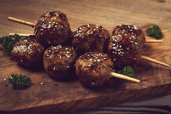 Tsukune, Japanese meatballs, minced chicken, fried on a skewer, with yakitori sauce, homemade, no