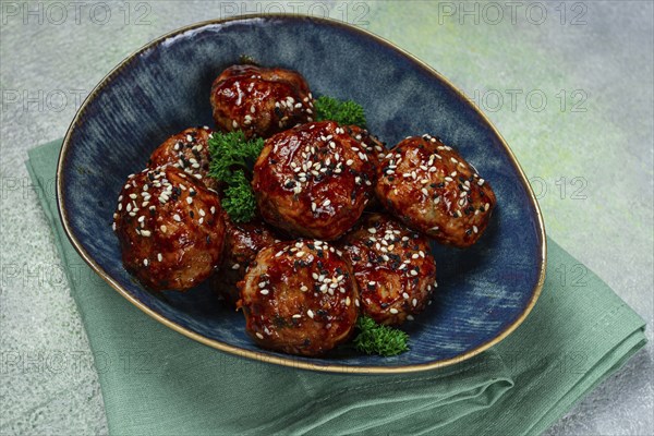 Tsukune, Japanese meatballs, minced chicken, fried on a skewer, with yakitori sauce, homemade, no