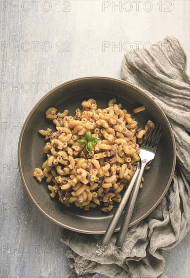 Pasta with stewed meat, pasta in the navy, horns, homemade, no people