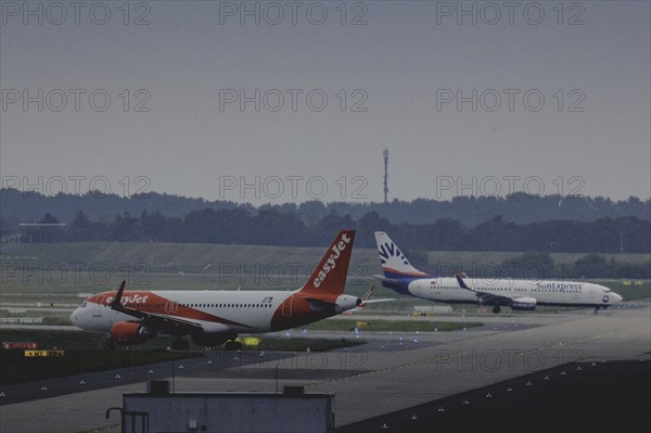 Two aircraft operated by easyjet and SunExpress, photographed at Berlin Brandenburg Airport 'Willy