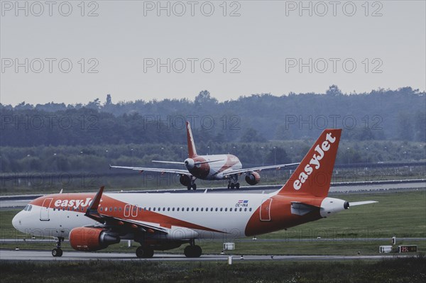 Two aircraft of the low-cost airline easyjet, photographed at Berlin Brandenburg Airport 'Willy