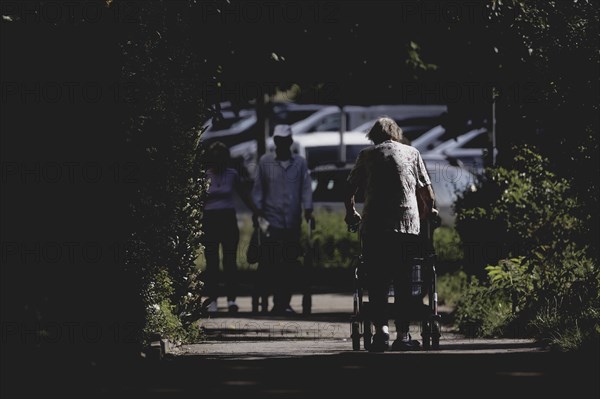 A woman with a rollator, photographed in Berlin, 07/08/2024