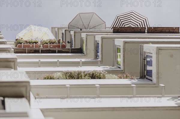 Parasols on the balcony of a prefabricated building, taken in Berlin, 07/08/2024