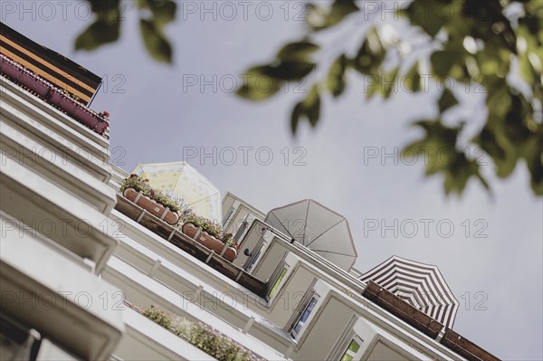 Parasols on the balcony of a prefabricated building, taken in Berlin, 07/08/2024