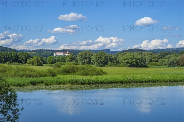 Landscape of Danubia river with reflection of the landscape and Clouds, Castle of Wörth an der