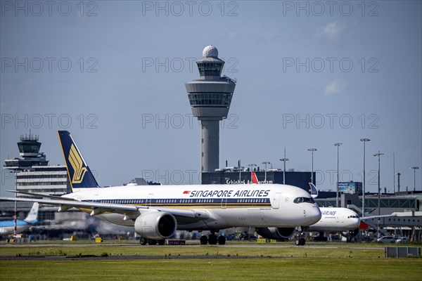 Aircraft at Amsterdam Schiphol Airport, on the taxiway for take-off on the Aalsmeerbaan, 18L/36R,