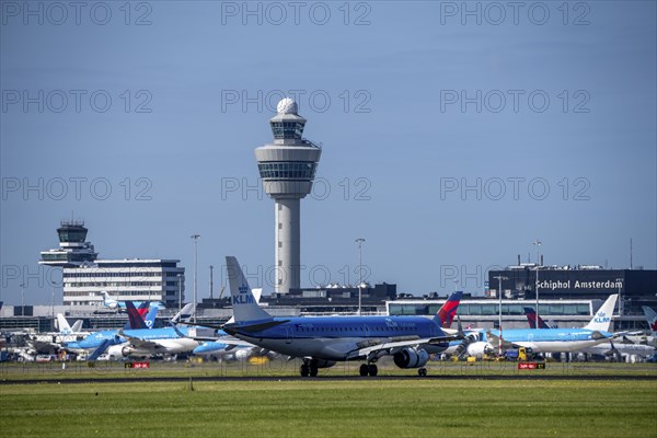 KLM Embraer E190STD aircraft landing at Amsterdam Schiphol Airport, Buitenveldertbaan, 09/27, Air