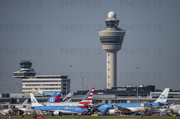 Aircraft at Amsterdam Schiphol Airport, taxiway, apron, air traffic control tower, terminal,