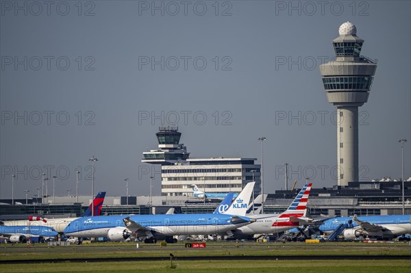 Aircraft at Amsterdam Schiphol Airport, taxiway, apron, air traffic control tower, terminal,