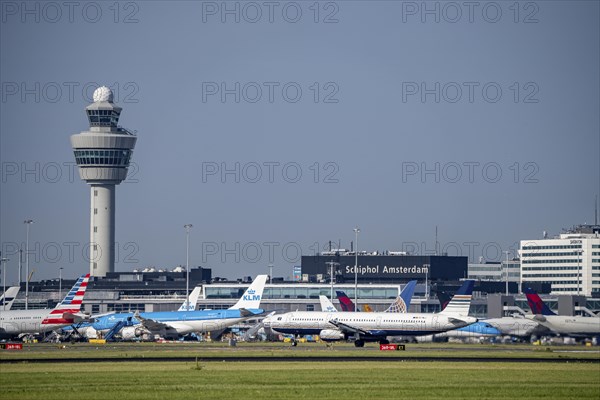 Aircraft at Amsterdam Schiphol Airport, taxiway, apron, air traffic control tower, terminal,