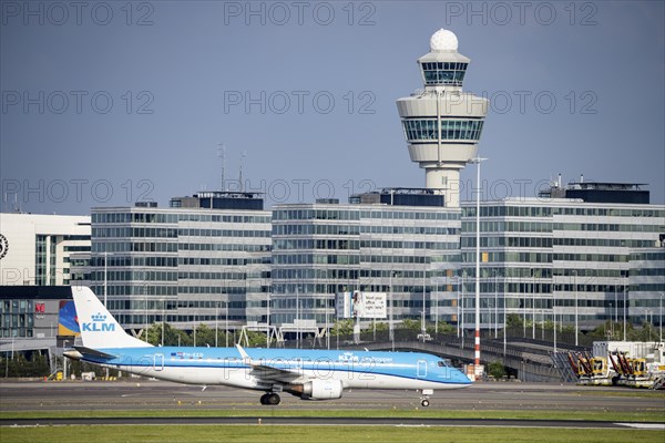 Amsterdam Schiphol Airport, KLM aircraft, Embraer E190STD, on the taxiway, in the background