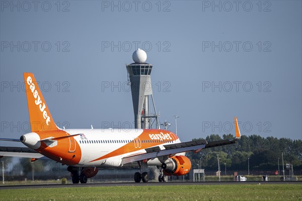 Easyjet aircraft after landing at Amsterdam Schiphol Airport, Polderbaan, 18R/36L, taxiway to