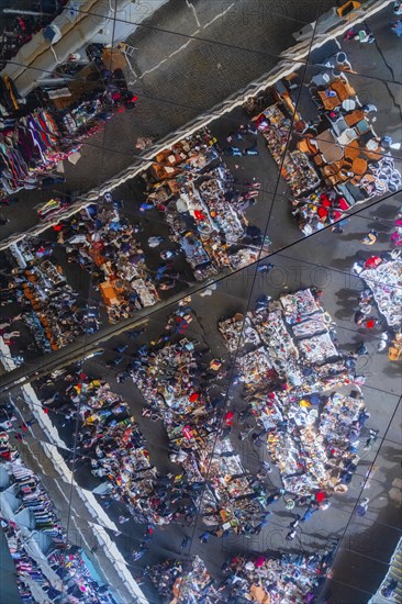 Reflection of the flea market in the modern roof construction of the Mercat dels Encants in