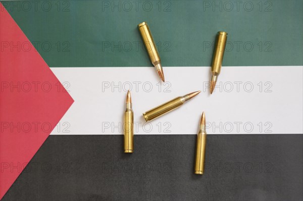 Palestinian flag with cartridges, Middle East conflict