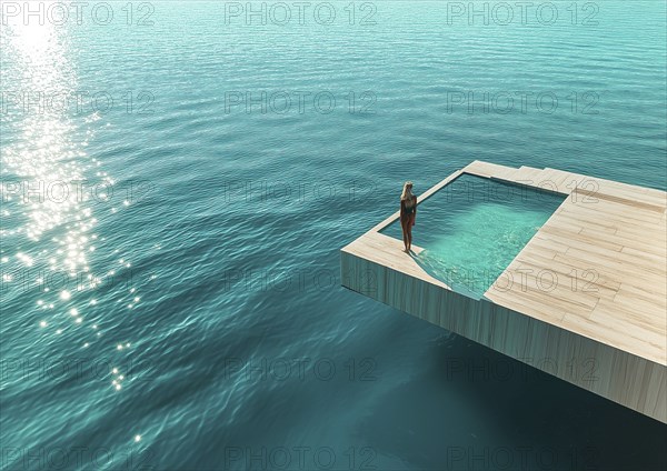 A woman stands by an infinity pool extended over the clear ocean, radiating tranquility and luxury,