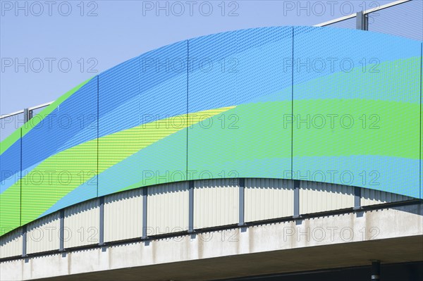 Colourfully painted motorway bridge with noise barrier over the river Este, Buxtehude, Altes Land,