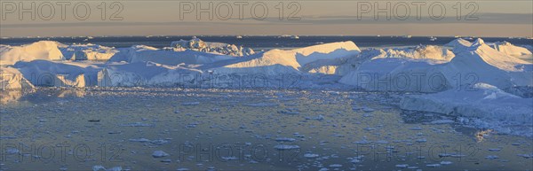 Icebergs reflected in fjord, midnight sun, summer, panorama, Ilulissat Icefjord, Disko Bay, West