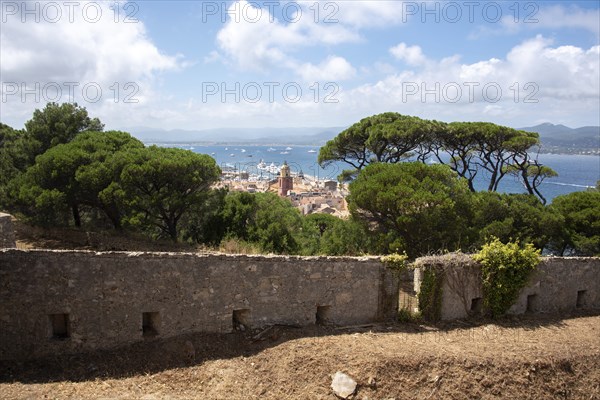 View over the roofs of Saint Tropez with the church Notre-Dame de l'Assomption, behind it the bay