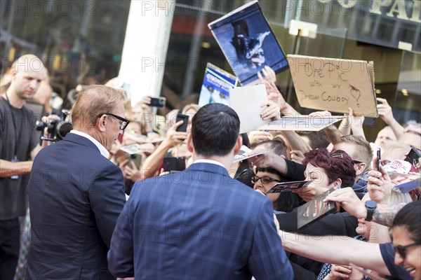 Kevin Costner signs autographs at the premiere of Horizon at Berlin's Zoo Palast on 04/08/2024
