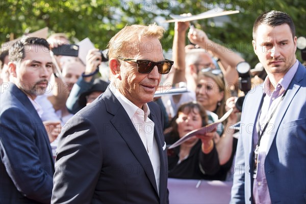 Kevin Costner signs autographs at the premiere of Horizon at Berlin's Zoo Palast on 04/08/2024