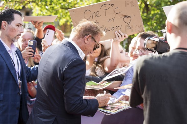 Kevin Costner signs autographs at the premiere of Horizon at Berlin's Zoo Palast on 04/08/2024