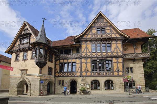 Henneberger Haus built in 1895, brown half-timbered house with bay windows, ornaments and turrets,