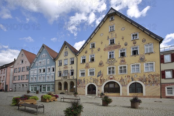 Historic half-timbered houses with town hall built in 1765 with murals and yellow guardhouse built
