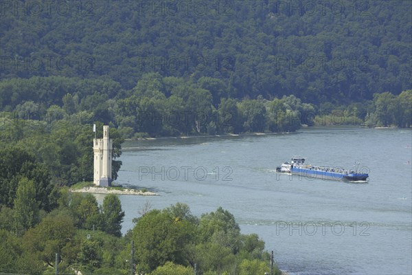 View of Mäuseturm on the Rhine with cargo ship, Binger Loch, Bingen, Rhine-Hesse region,