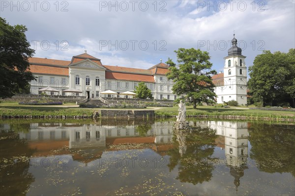 Baroque Fasanerie Castle with pond and statue in the water and castle garden, reflection, Fasanerie