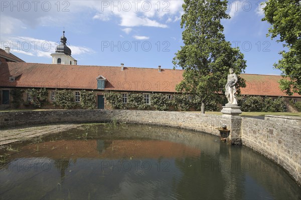 Inner courtyard with fountain at Schloss Fasanerie, statue, water basin, Eichenzell, Hesse,