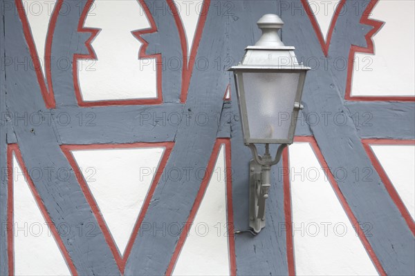 Street lamp on the wall of a half-timbered house, red, grey, frame, border, detail, decoration,