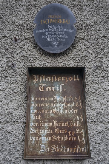 Historic tin sign on the house from 1497 of the last plaster customs station of Mainbernheim, Lower