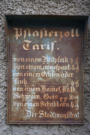 Historic tin sign on the house from 1497 of the last plaster customs station of Mainbernheim, Lower