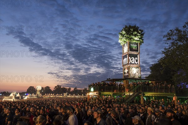 Tower of the sponsor Krombacher at dusk at the Wacken Open Air in Wacken. The traditional metal