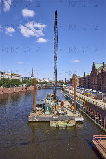 Crane on a pontoon in the inland harbour, construction site at the quay wall and Kehrwieder street,