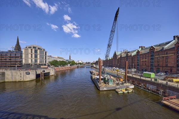 Crane on a pontoon in the inland harbour, construction site at the quay wall and Kehrwieder street,