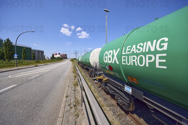 Road with railway tracks and tank wagons from GBX Leasing Europe in the Port of Hamburg, Free and