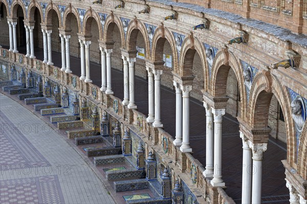 Colonnade and tiled benches of the pavilion at the Plaza de Espana in Seville, Andalusia, Spain,