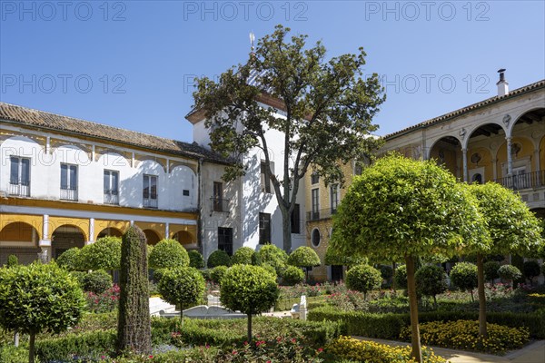 Garden with exotic plants, Casa de Pilatos city palace with Mudejar style elements, Seville,